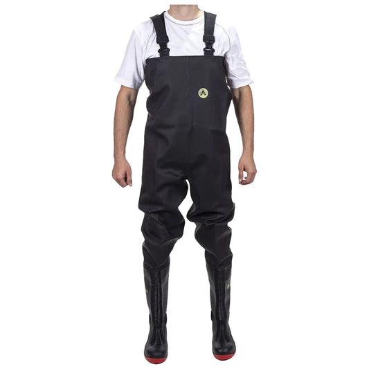 A person is wearing black waterproof waders with straps and red soles while standing upright. The background is plain, emphasizing the attire designed for wet environments.