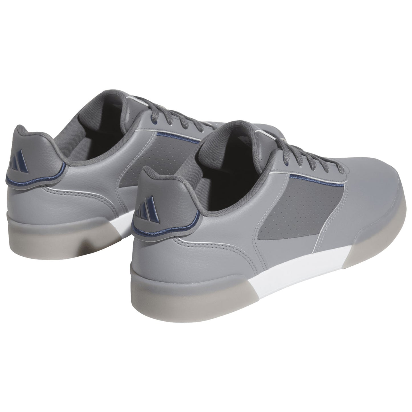 Gray athletic shoes are positioned to show the back and side. They feature a sleek design with a smooth finish and subtle detailing, set against a plain white background.