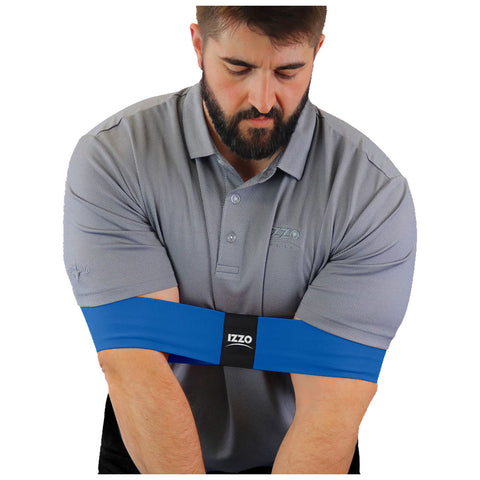 A man wearing a gray polo shirt is applying a blue arm sleeve with a black logo around his forearms while looking down, suggesting preparation for an activity or sport.