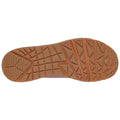 A shoe's sole is displayed revealing a textured rubber surface designed for traction and stability suitable for various terrains resting on a flat background