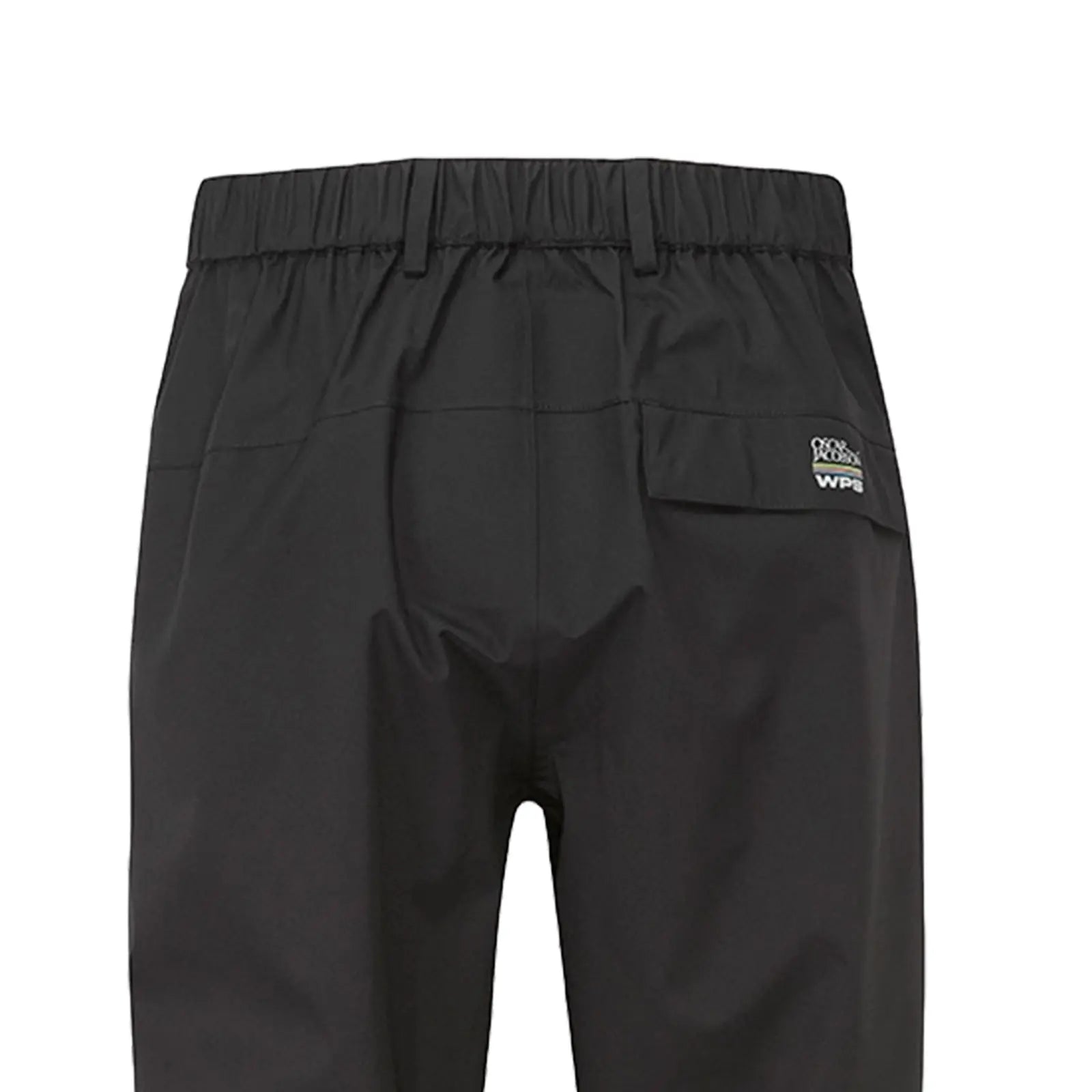 Black waterproof pants hang vertically showcasing their elastic waistband and a rear pocket with branding near the top edge in a simple undisturbed setting