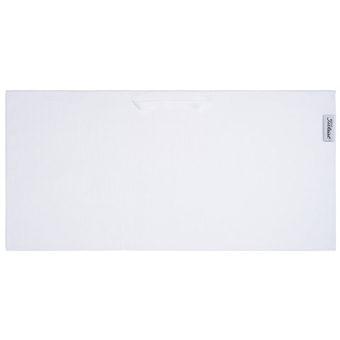 A rectangular white towel lies flat on a surface designed for drying or cleaning use with a small handle on one side for easy transport.