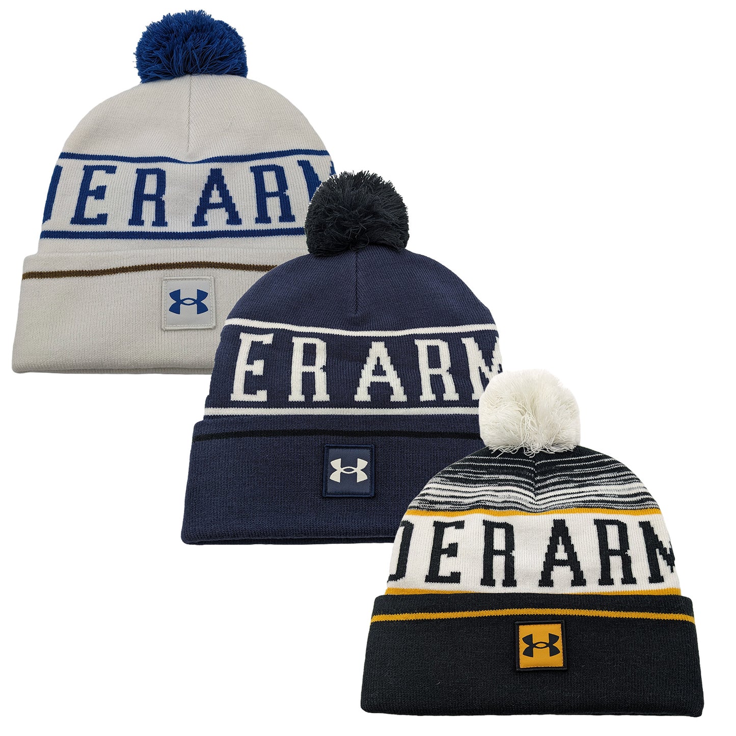 Three knitted beanies are displayed side by side featuring pom-poms on top each with distinct color patterns and the brand name prominently featured on the front.