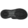 A shoe sole made of black rubber displaying a textured pattern designed for grip and stability is shown against a plain white background, emphasizing its functional features.