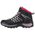 A mid-cut hiking boot features a dark exterior with pink accents and white laces designed for outdoor activities providing support and traction suitable for rugged terrains.