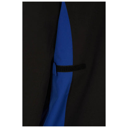A black garment features a contrasting blue panel integrated into the design secured with a black fastening strip showcasing a modern and functional style in clothing design.