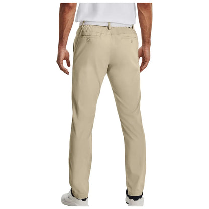 A person is wearing light-colored golf chinos with an elastic waistband, standing with their back facing the viewer in a casual setting. The look is complemented by white shoes and a short-sleeved shirt, ideal for a relaxed golfing outfit.