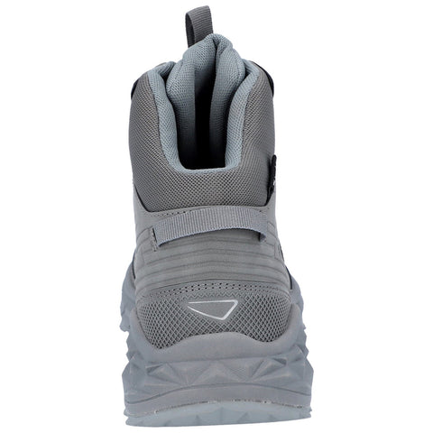 A gray hiking boot stands upright showcasing a textured surface and a robust sole designed for traction in outdoor environments with a loop at the back for easy wear.