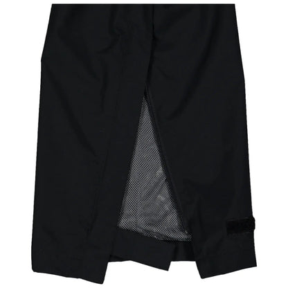 A black garment with a zippered opening reveals a mesh lining inside the hem enhancing ventilation in an outdoor or active wear context