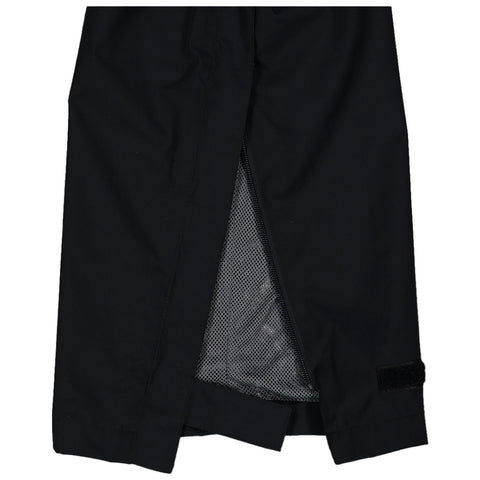 A black garment with a zippered opening reveals a mesh lining inside the hem enhancing ventilation in an outdoor or active wear context