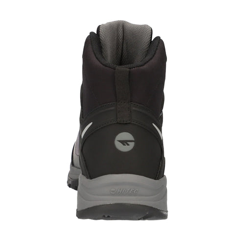 A black hiking boot is positioned upright showcasing a padded collar and smooth exterior while the surrounding environment appears neutral and unobtrusive, highlighting the boot's design and functionality.