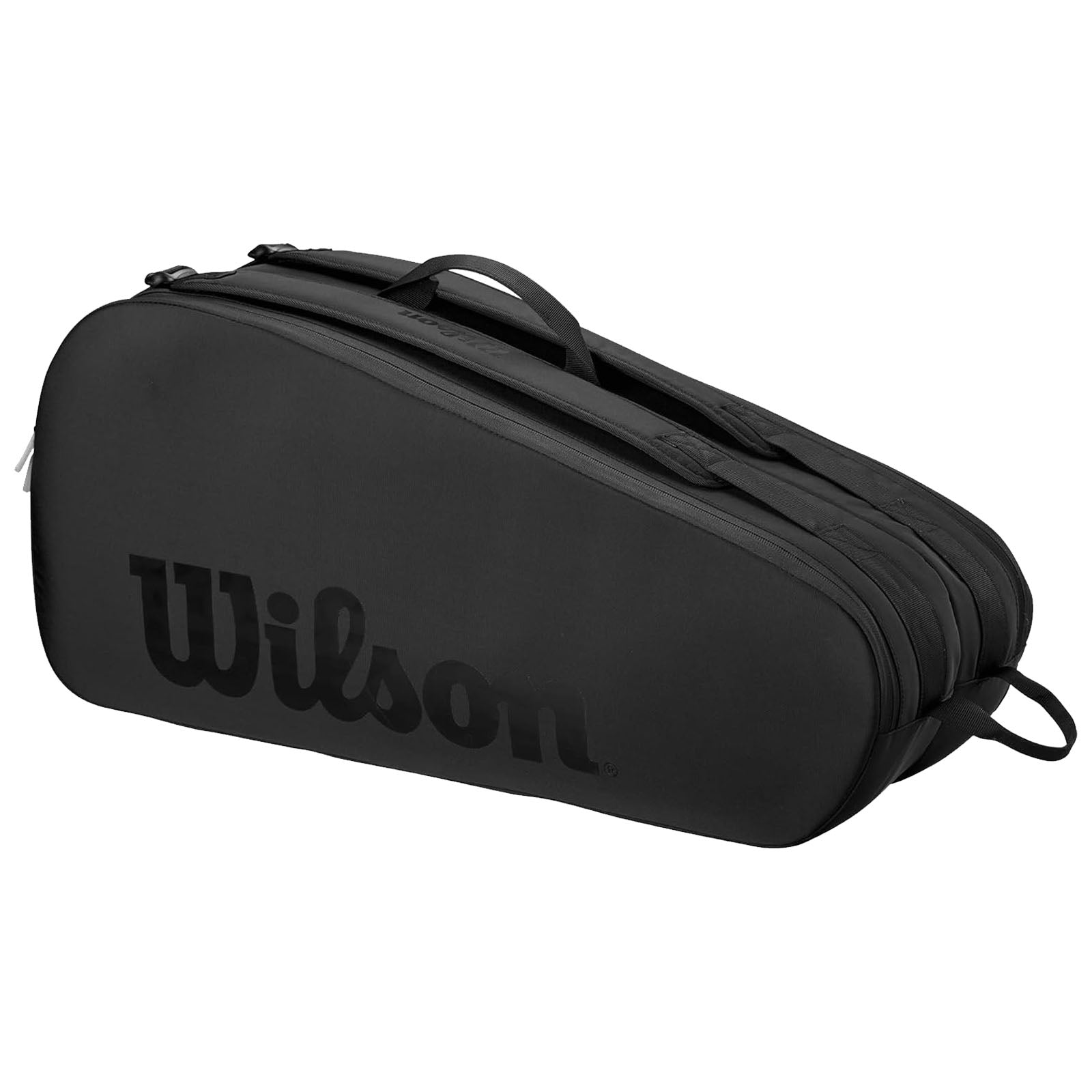 A black tennis bag with a streamlined design rests on a surface featuring a prominent Wilson logo the bag is designed for carrying tennis equipment comfortably.