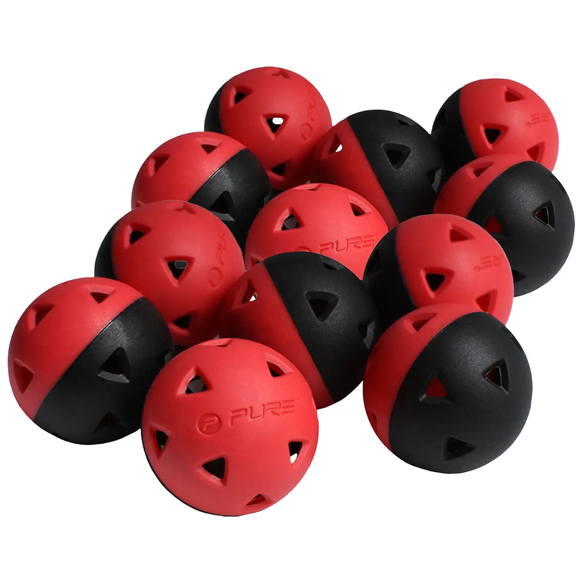A cluster of rubber balls features a mix of red and black halves with triangular cutouts scattered together on a flat surface, suggesting play or sport-related activity.