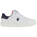 A white sneaker with navy and red accents features a textured sole and a logo on the side, positioned against a plain background, highlighting its design and colors.