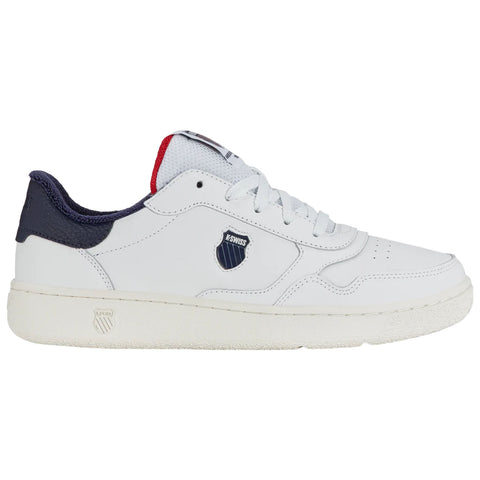 A white sneaker with navy and red accents features a textured sole and a logo on the side, positioned against a plain background, highlighting its design and colors.