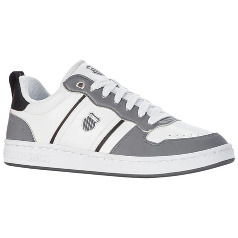 A sneaker with a predominantly white base features grey accents and black detailing. It displays three stripes along the sides and a logo on the upper.