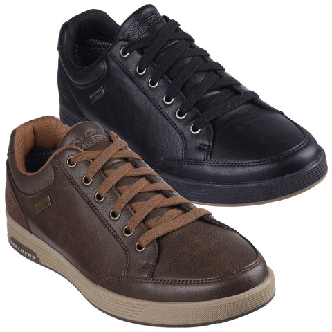 Two pairs of stylish sneakers are displayed side by side. One is black with a smooth finish and the other is brown with a textured appearance, both featuring prominent laces and branding.