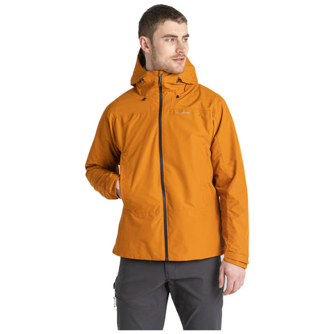 A man is standing while wearing an orange jacket with a hood. He is looking slightly to the side, showcasing the jacket in a neutral background.