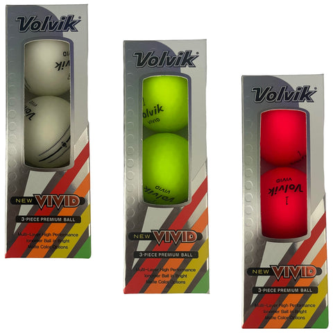 Three boxes containing golf balls are displayed. The left box has two white balls, the middle contains two bright green balls, and the right box holds two red balls. Each box features the brand Volvik and the text "NEW VIVID" along with descriptions of the balls.