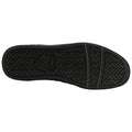 A black rubber shoe sole is displayed with a textured, treaded surface designed for grip and traction, showcasing its underside without any surrounding context or additional elements.