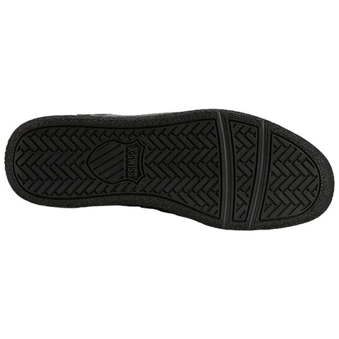 A black rubber shoe sole is displayed with a textured, treaded surface designed for grip and traction, showcasing its underside without any surrounding context or additional elements.