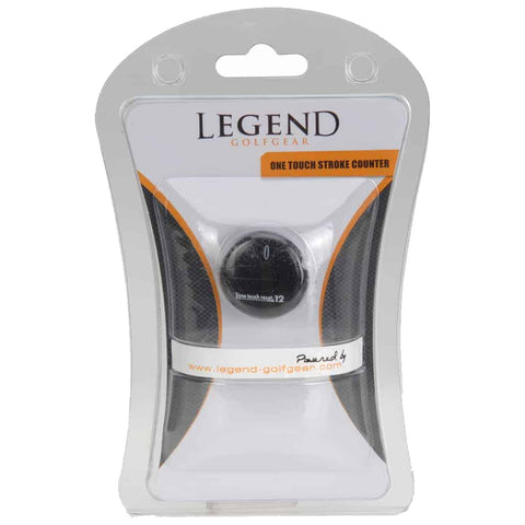 A golf stroke counter is displayed in transparent packaging featuring a circular dial for counting strokes with numbers visible and text indicating the product name and website.