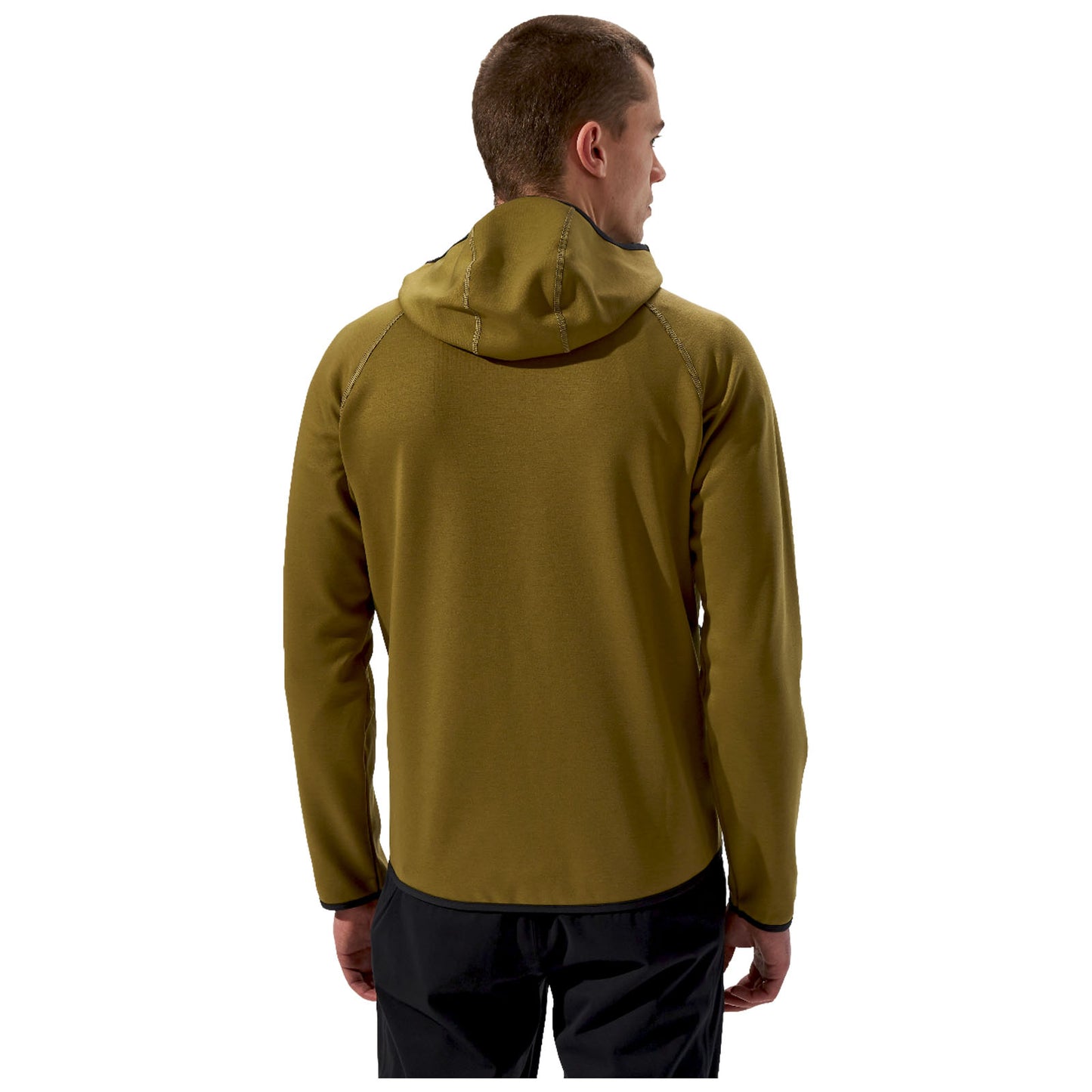 A man wearing a green hooded jacket stands with his back to the viewer in a neutral setting with no distinct background elements or distractions visible around him.