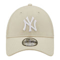 A beige baseball cap features a white embroidered NY logo on the front and has a curved brim with adjustable sizing for the wearer. The cap is made of mesh material.