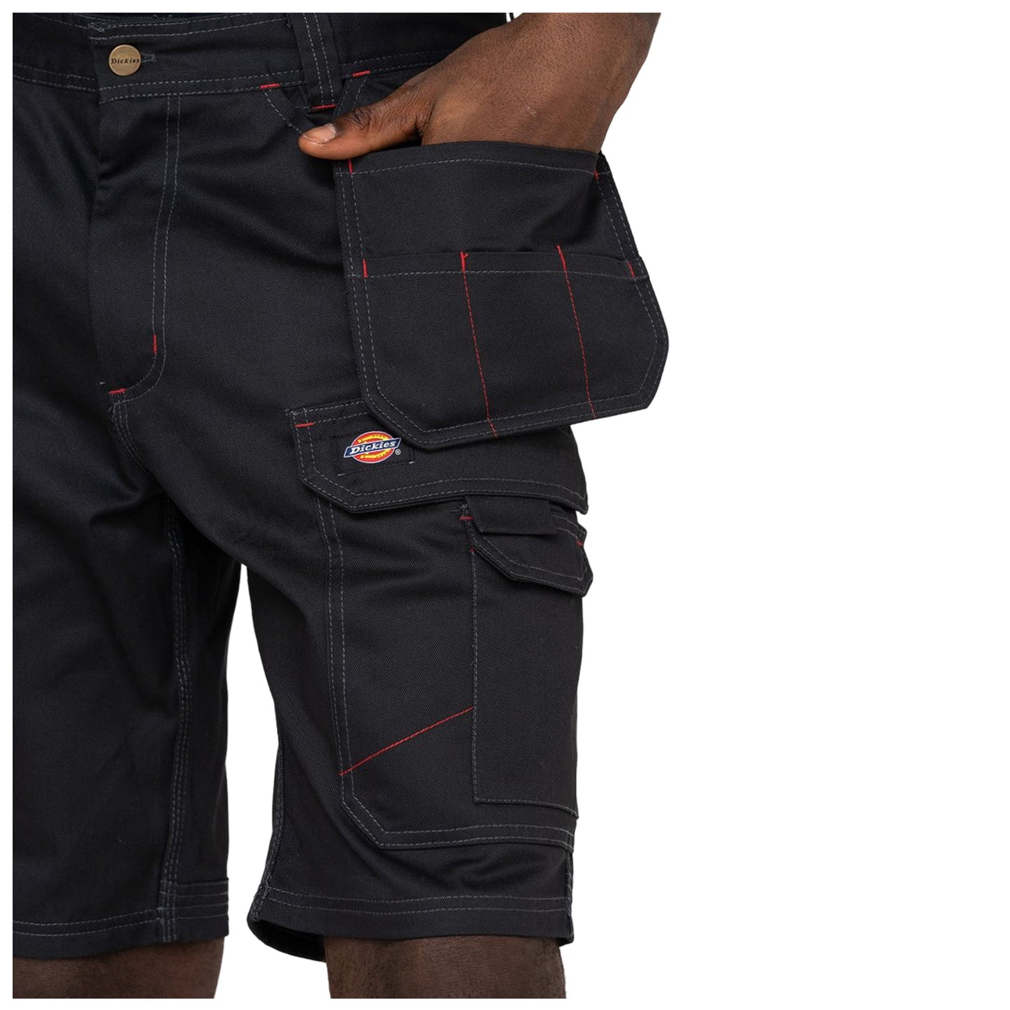 Black cargo shorts are being worn by a person with a hand reaching into a side pocket featuring red stitching and a logo. The background is not visible.