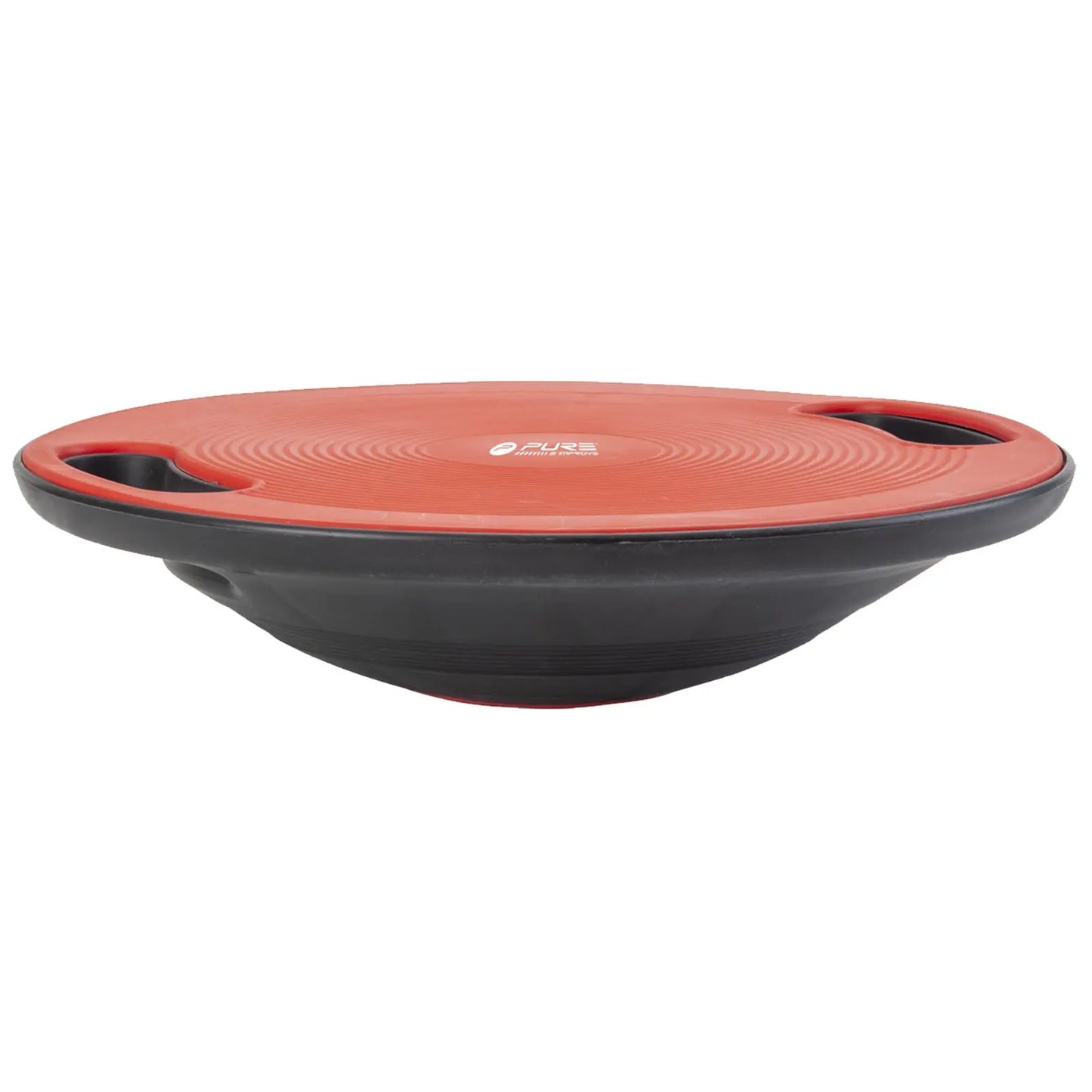 A balance board is positioned horizontally with a red circular top and black bottom featuring two side handles for grip used for stability training and exercise in a fitness environment.