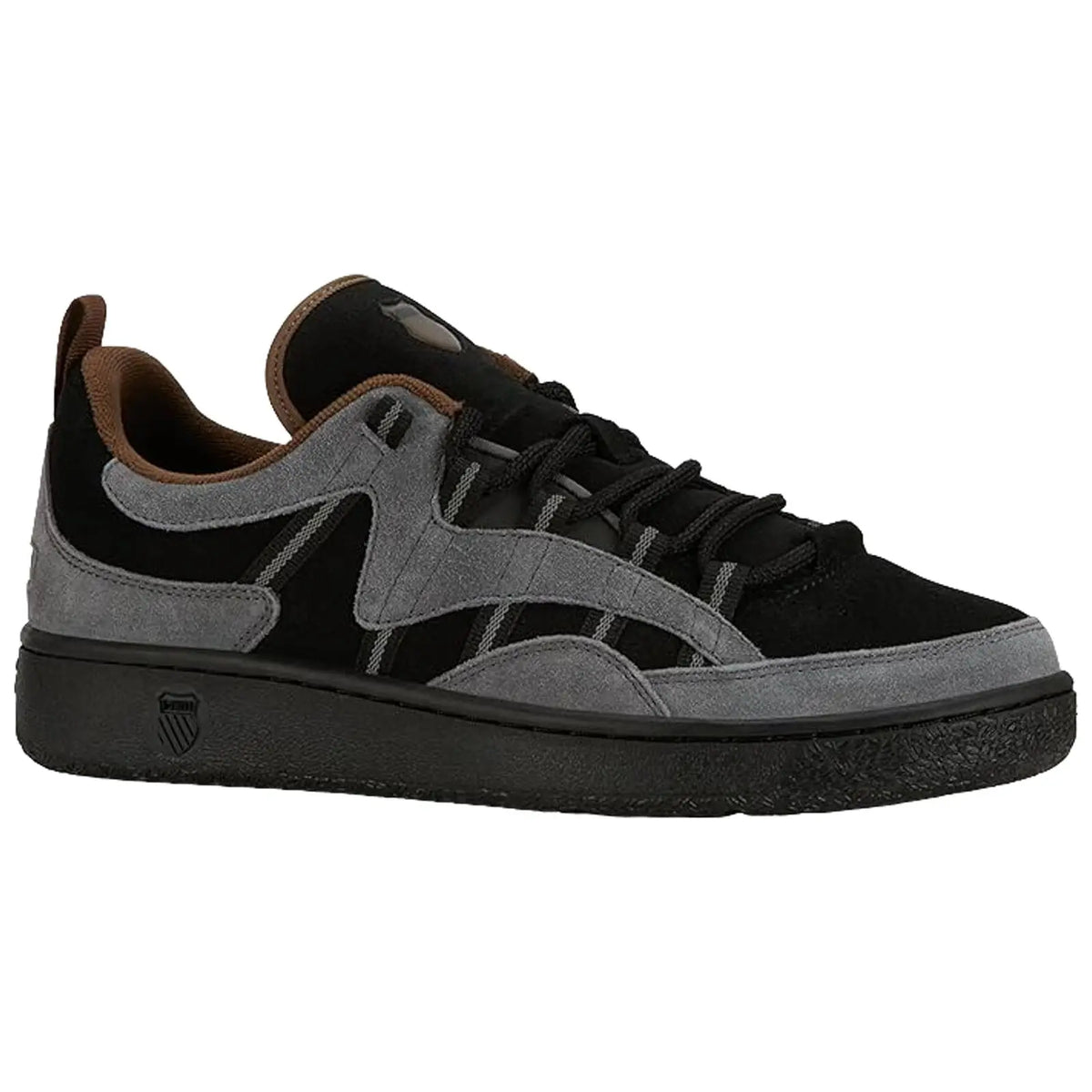 A black and gray sneaker features a suede upper with a rubber sole and sturdy laces positioned on a white background emphasizing its design and color contrast.