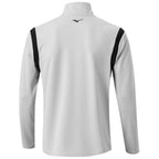 A long-sleeved athletic shirt in light gray features black shoulder accents and a high collar, designed for sportswear use. The brand logo appears on the upper back.