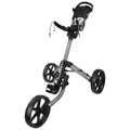 A golf pushcart with three large wheels is positioned upright featuring a handle with a storage area where gear can be placed showcasing a lightweight, metallic frame designed for easy maneuverability on golf courses.