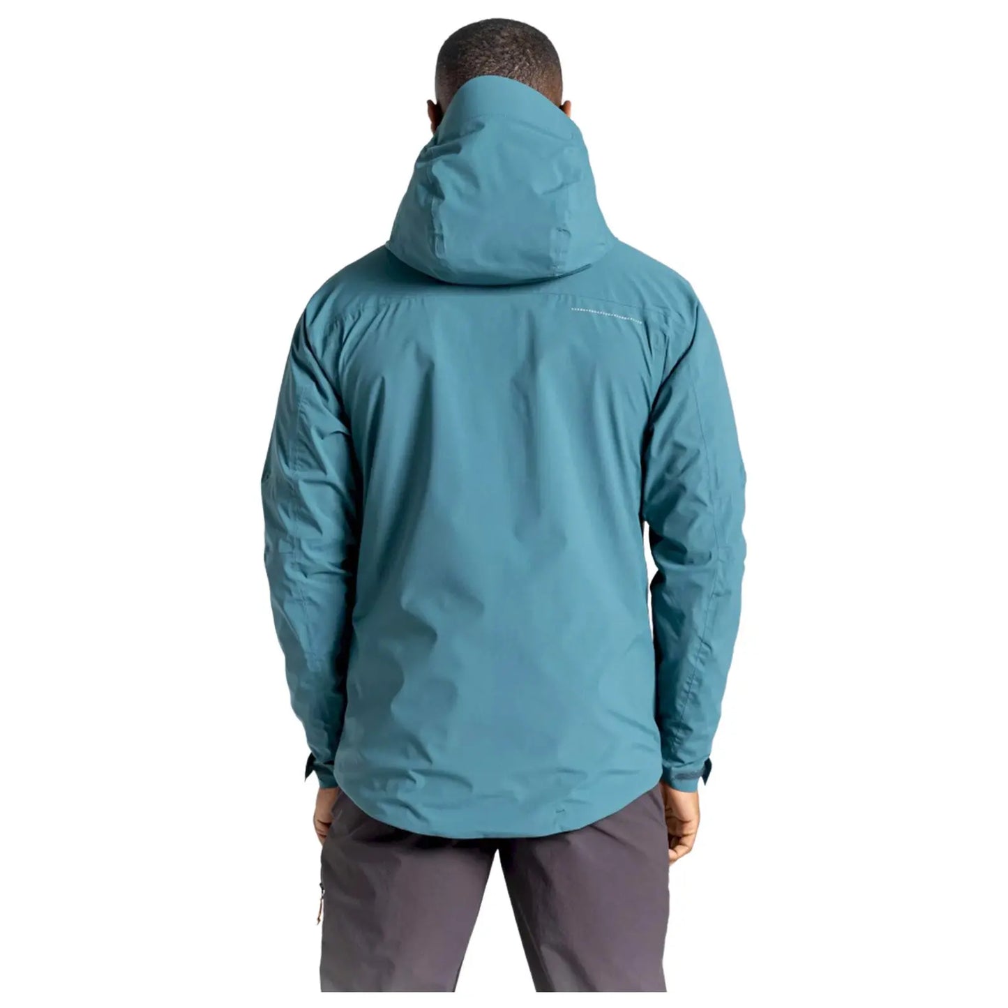 A person is wearing a teal waterproof jacket with a hood facing away from the viewer against a plain white background, suggesting a focus on the jacket's design and color.