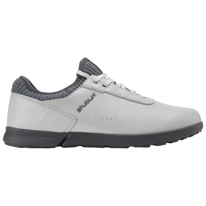 A grey and white athletic shoe rests on a flat surface showcasing a sleek design with a rounded toe laced up and a textured collar for added support.