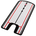 A rectangular putting mirror designed for golf practice displays bold black and red lines with circular holes marking alignment points situated on a flat reflective surface for improving putting skills.