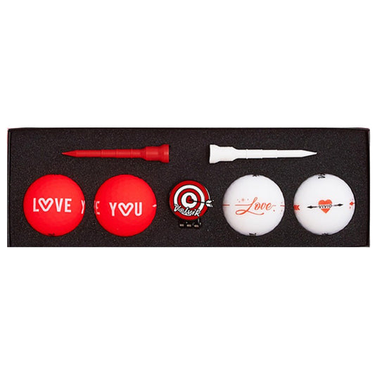 A set of golf accessories includes three red golf balls marked with "LOVE YOU," a white golf ball with "Love," two golf tees in red and white, and a ball marker.