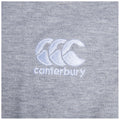 A gray textile features an embroidered logo displaying three stylized wave shapes above the word canterbury in white thread, set against a subtly textured background.