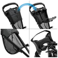 A black multi-functional stroller is shown adjusting its seat and handle features the seat tilts and the handle moves while surrounded by a neutral background indicating the product's usage context.