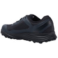 A black athletic shoe is positioned sideways showcasing its textured sole and sleek design emphasizing performance and durability suitable for outdoor activities in various terrains.