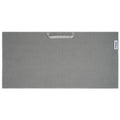 A gray textured mat with a handle is displayed flat on a surface featuring a subtle pattern and a logo on one corner indicating the brand is Titleist