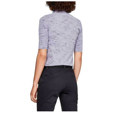 A person is standing, wearing a fitted short-sleeve shirt with a subtle pattern and high collar paired with black pants, facing away from the viewer, showcasing the outfit's design.