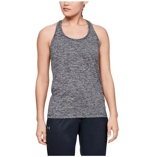 Under Armour Ladies Tech Twist Tank Top 1275487 A person stands wearing a gray athletic tank top and dark pants with a neutral expression in a plain background, suggesting a casual or active setting