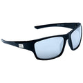 Black sunglasses with sleek frames rest on a flat surface reflecting light in a minimalistic setting showcasing their sporty design and UV protection features.