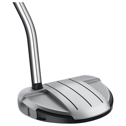 A golf putter features a sleek silver head with ridges for grip positioned at an angle above a black base showcasing a smooth metallic shaft in a neutral background