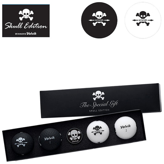 A black gift box holds four golf balls, two black and two white, each displaying a skull design. The packaging is labeled "The Special Gift Skull Edition" and features Volvik branding.
