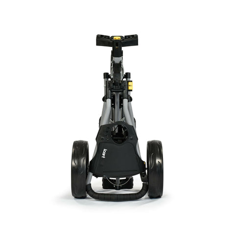 A golf trolley with a compact frame features two large wheels and a handle. It stands upright with a black and gray design against a white background.