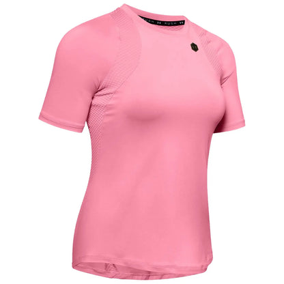 A short-sleeved pink athletic shirt is displayed prominently it features a fitted design with textured side panels indicating a focus on performance and comfort ideal for sports or fitness activities.