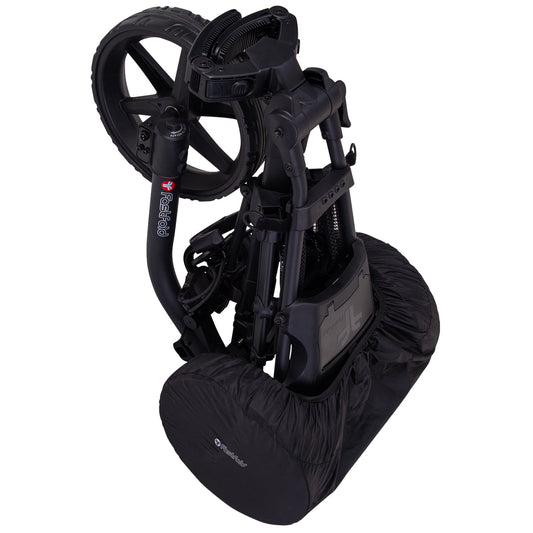 A black golf trolley is folded compactly with its two large back wheels positioned vertically while a fabric cover encloses the lower section providing protection during storage or transport.