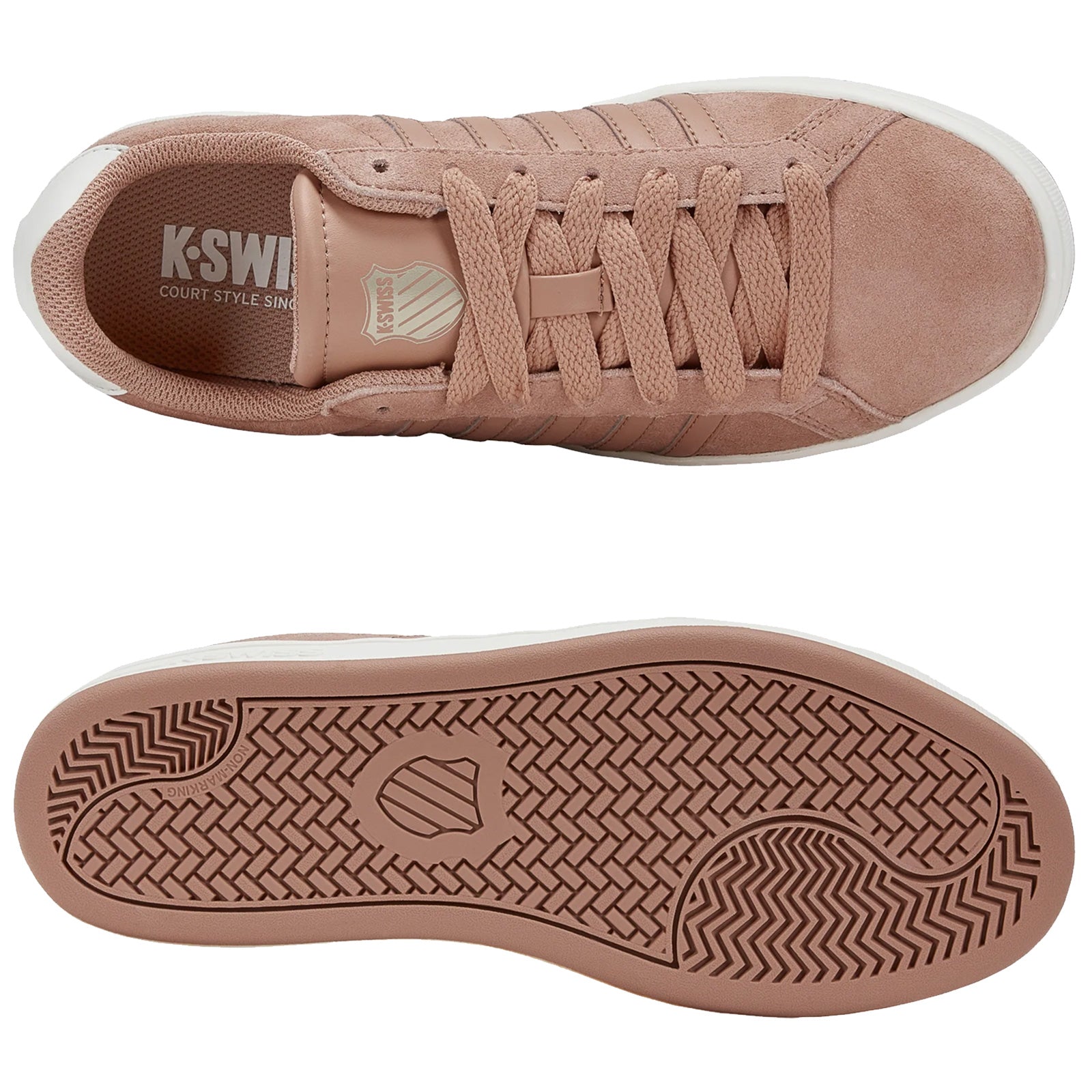 Tan suede sneakers with textured laces and a rubber sole are displayed from above showcasing their sleek design and branding on the tongue with a white outsole featuring a patterned tread.